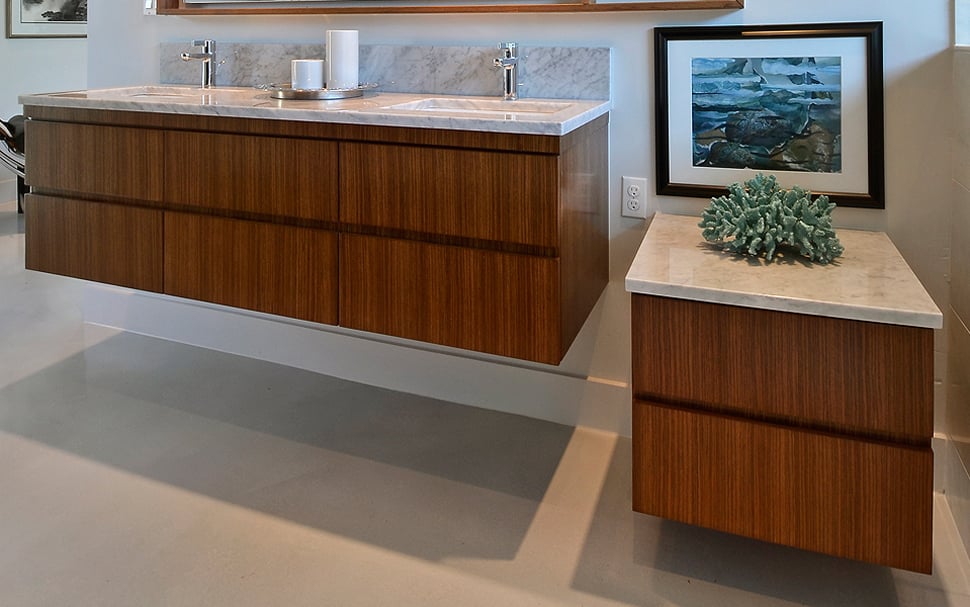 A floating vanity features large, seamless under-sink drawers.
