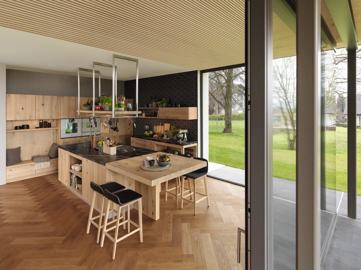 Solid wood kitchen cabinetry and island dining table.